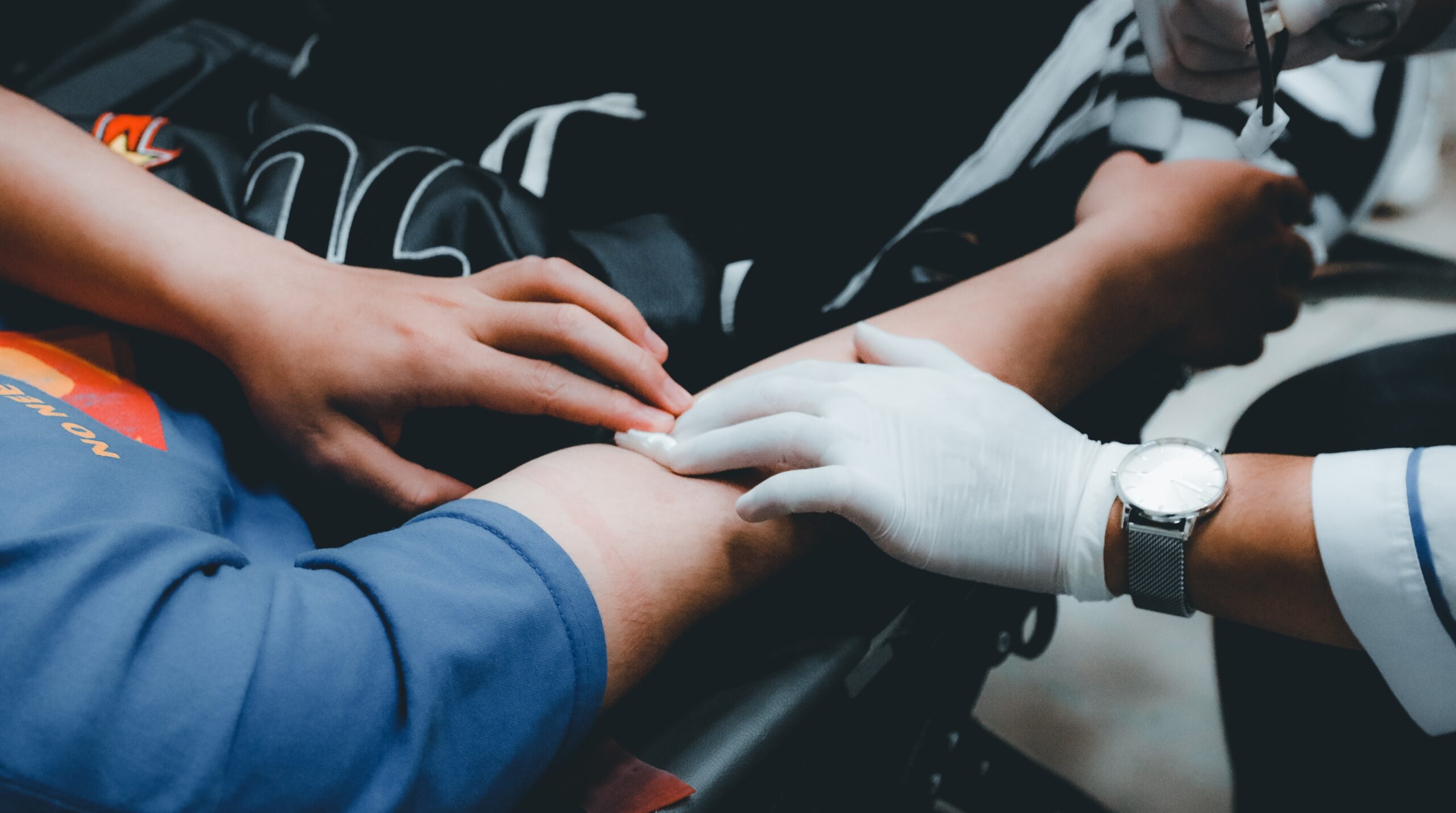 doctor transfusing blood